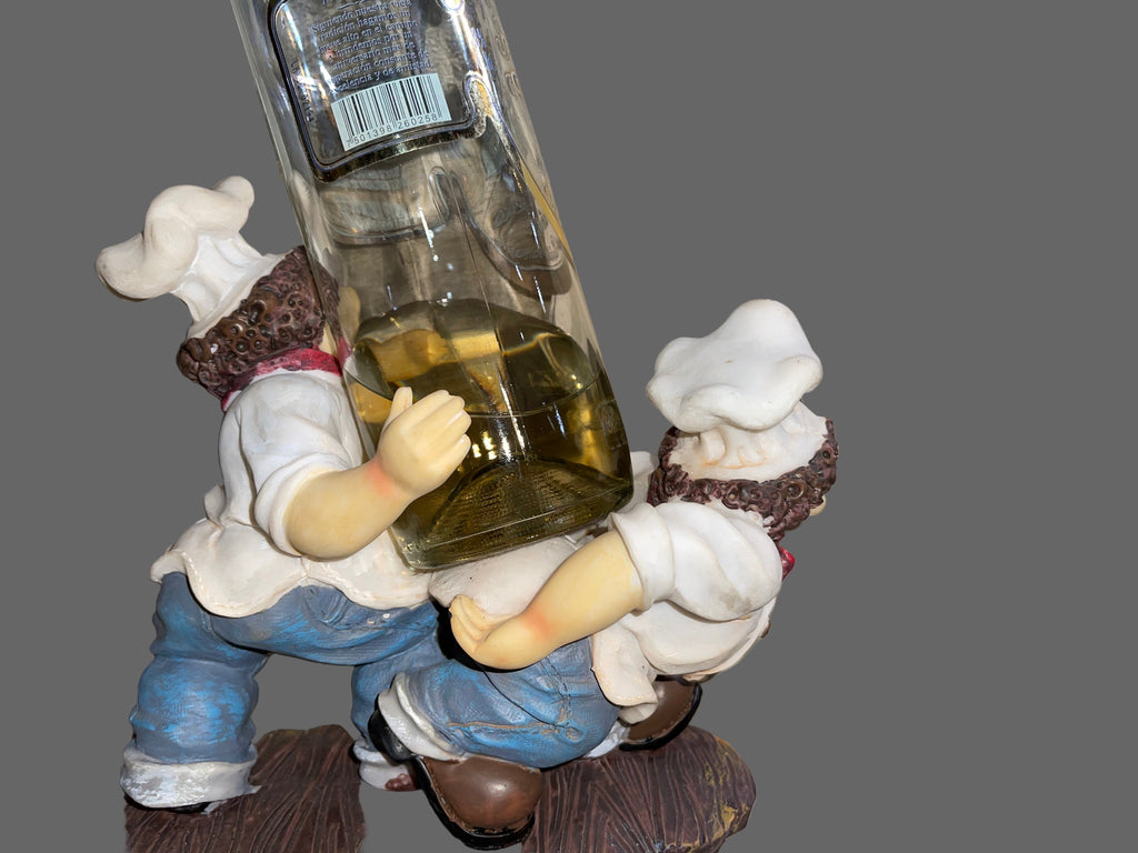 Toy figure holding a bottle on a striped surface