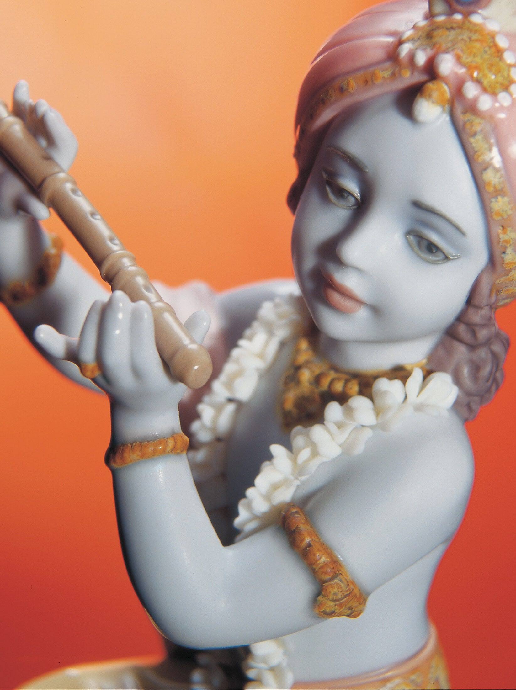 Lladro Krishna  playing the flute